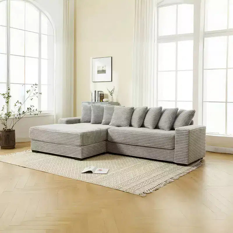 Canapé d'angle en velours côtelé et bois GDFStudio Isabel 111 avec huit oreillers
