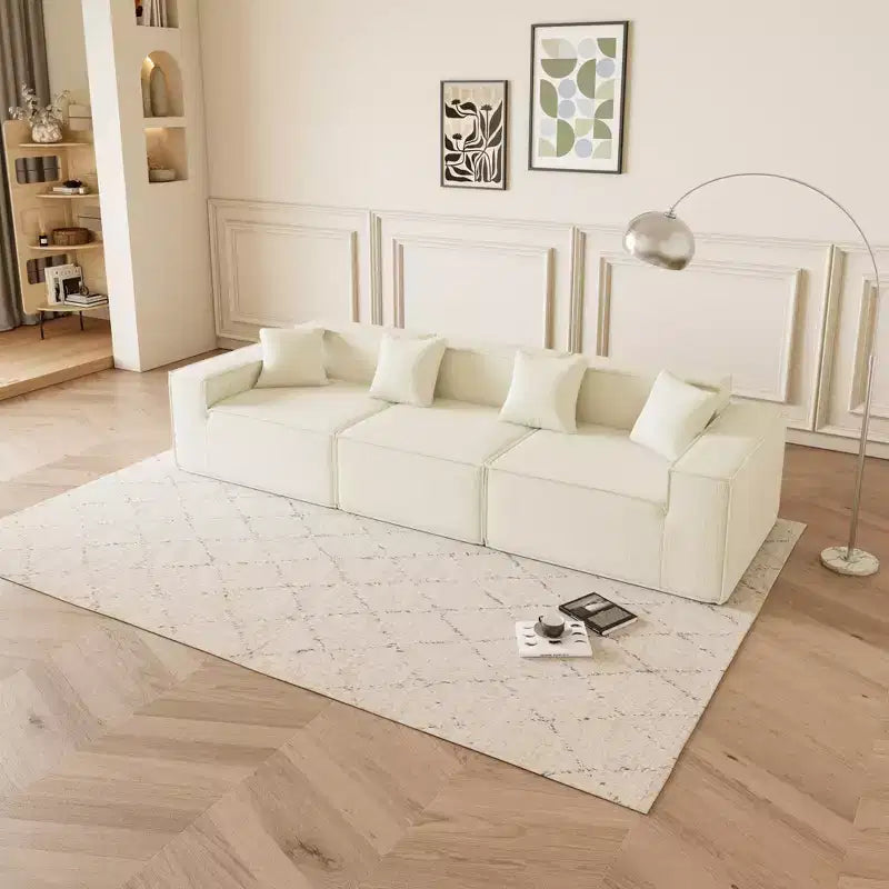 Canapé sectionnel GDFStudio Nira moderne de 277 cm à 3 places réversible sans cadre, recouvert de velours côtelé, avec pouf et 4 oreillers
