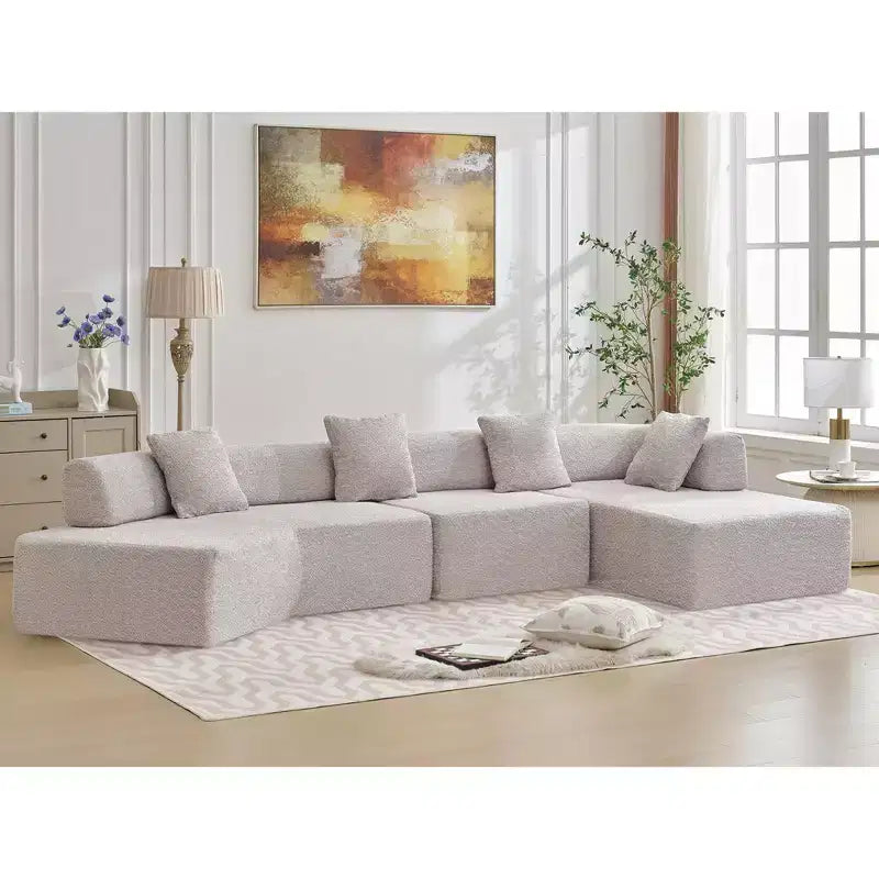 Canapé d'angle moderne 4 places en bouclette GDFStudio Arvik 140 avec 4 coussins
