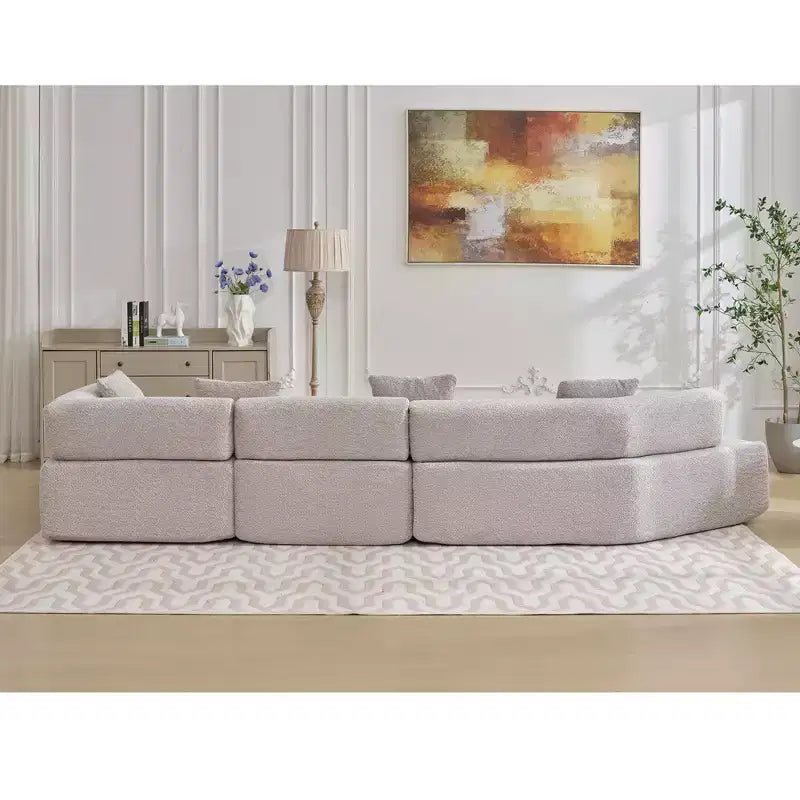 Canapé d'angle moderne 4 places en bouclette GDFStudio Arvik 140 avec 4 coussins