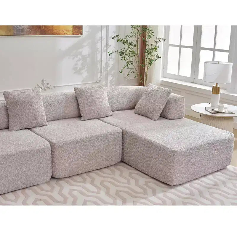 Canapé d'angle moderne 4 places en bouclette GDFStudio Arvik 140 avec 4 coussins