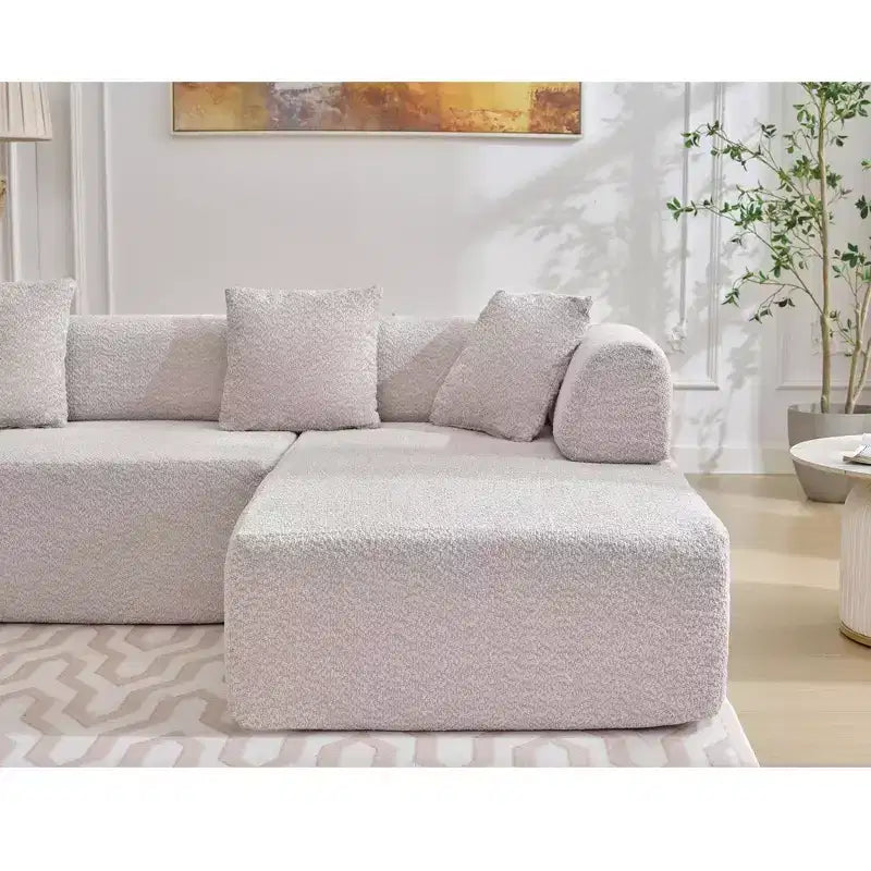 Canapé d'angle moderne 4 places en bouclette GDFStudio Arvik 140 avec 4 coussins