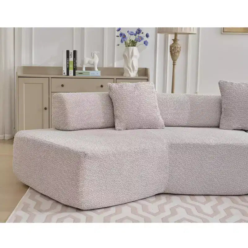 Canapé d'angle moderne 4 places en bouclette GDFStudio Arvik 140 avec 4 coussins