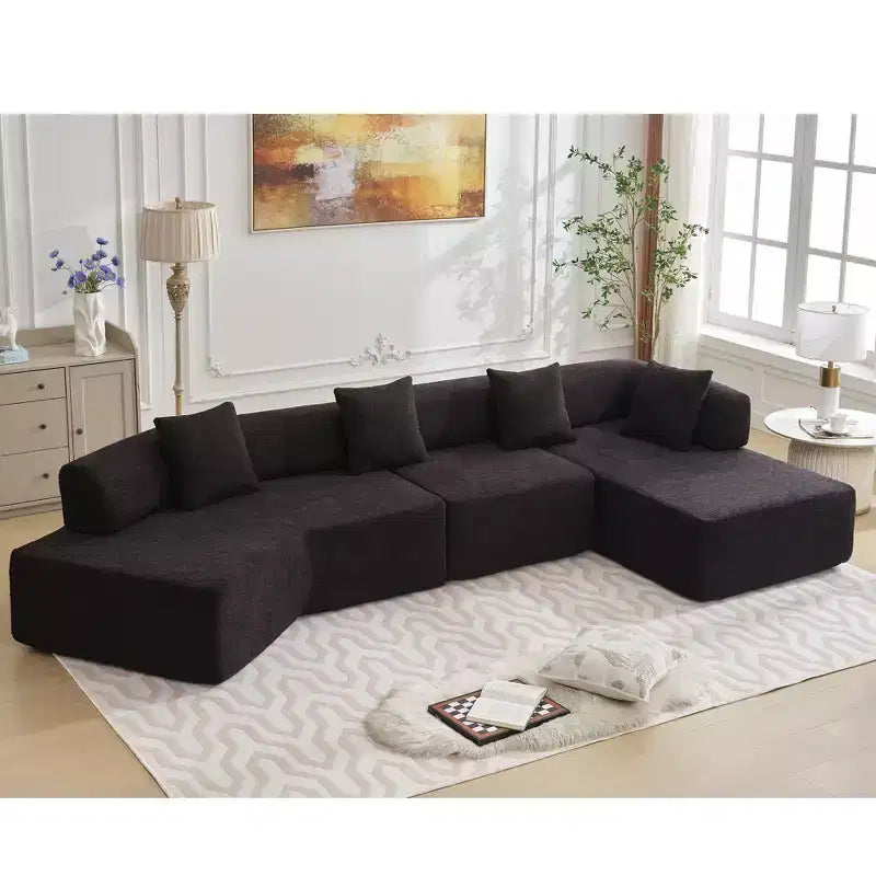 Canapé d'angle moderne 4 places en bouclette GDFStudio Arvik 140 avec 4 coussins
