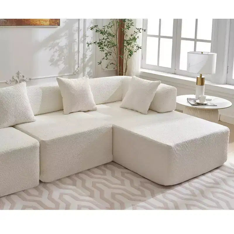 Canapé d'angle moderne 4 places en bouclette GDFStudio Arvik 140 avec 4 coussins