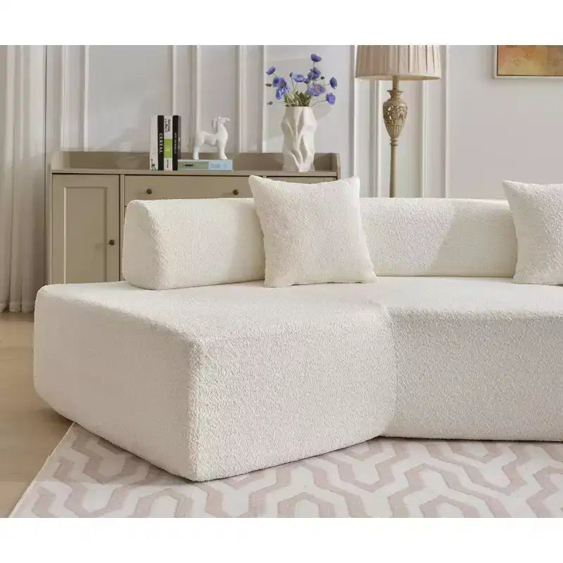 Canapé d'angle moderne 4 places en bouclette GDFStudio Arvik 140 avec 4 coussins