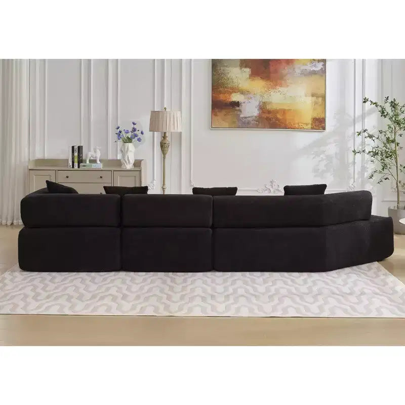 Canapé d'angle moderne 4 places en bouclette GDFStudio Arvik 140 avec 4 coussins