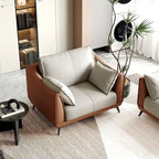 Fauteuil d'appoint en similicuir orange avec pieds noirs, une place